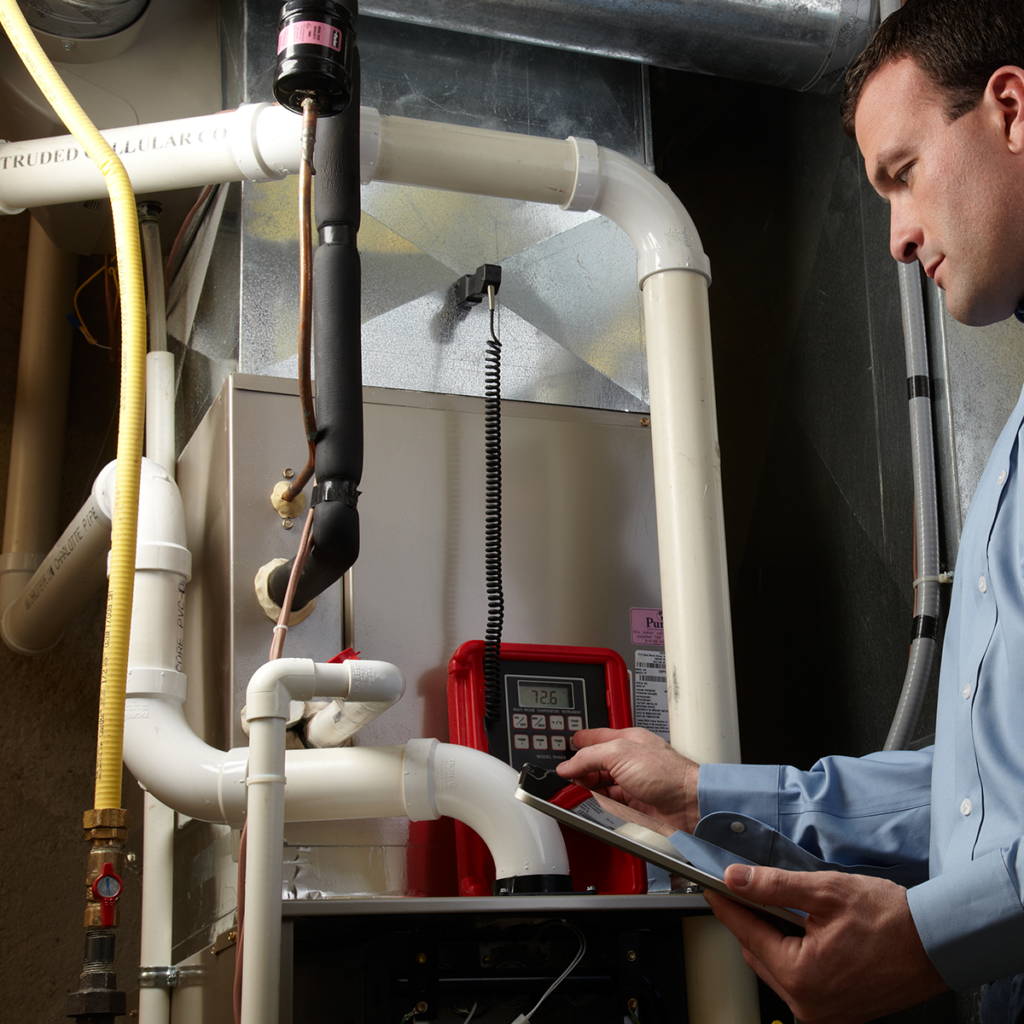 technician installing a heater inside a jupiter home