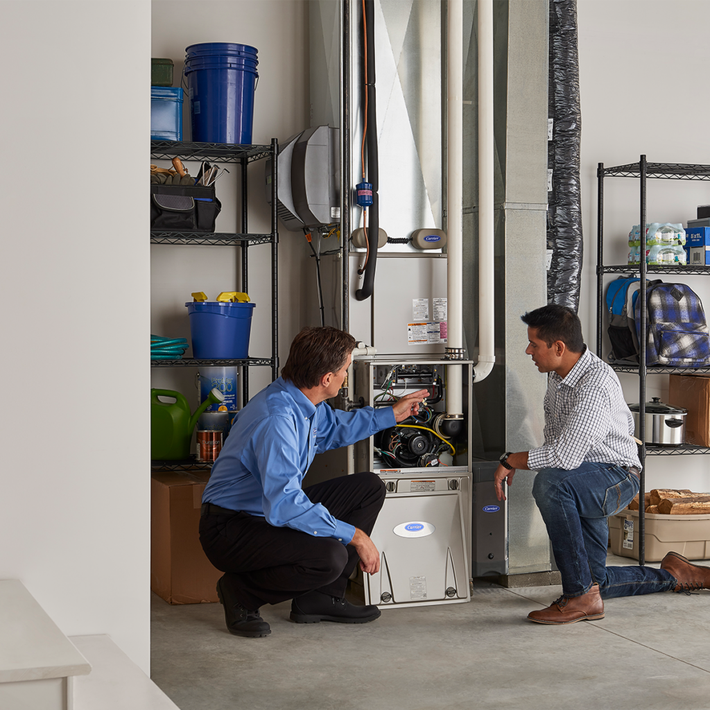 technician showing a jupiter homeowner areas of their heater need repair