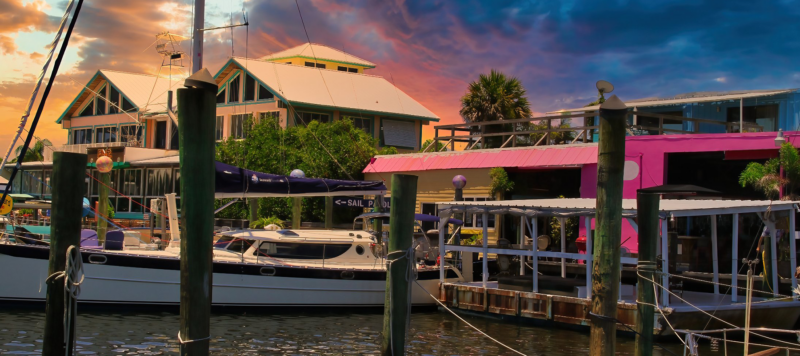 boats docked in a stuart, florida harbor at sunrise