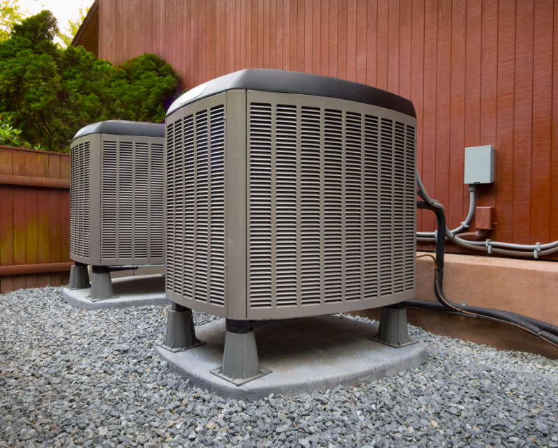 two heating units installed outside a home in jupiter