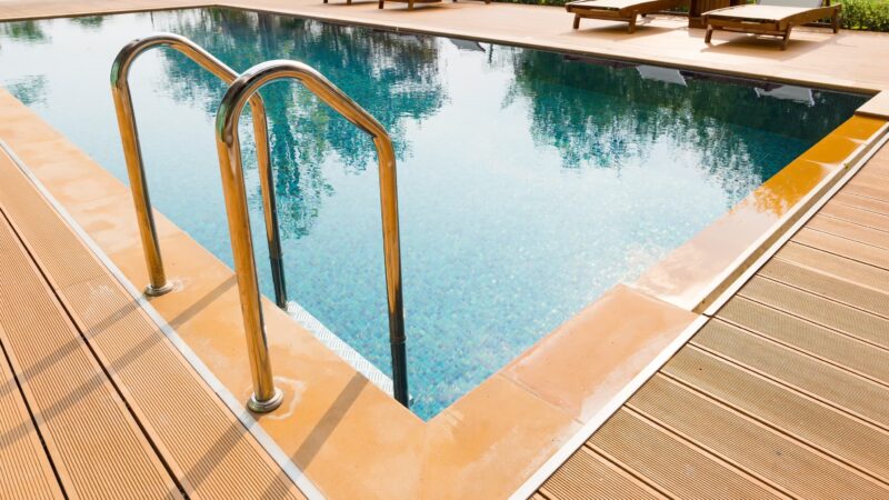 overview of pool with handle bars that lead inside the pool for easy access